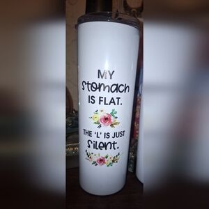 My stomach is flat. The L is silent stainless hot/cold tumbler